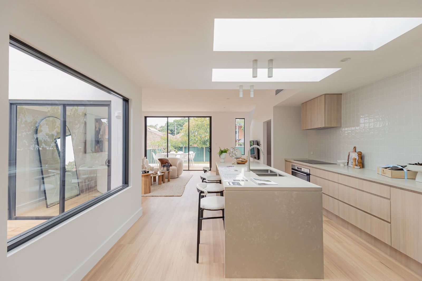 Duke Street, Kensington — After renovation — open-plan kitchen and living area with skylights and island bench